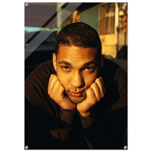 Young man portrait acrylic print, golden-hour cinematic style, face-mounted with silver standoffs.