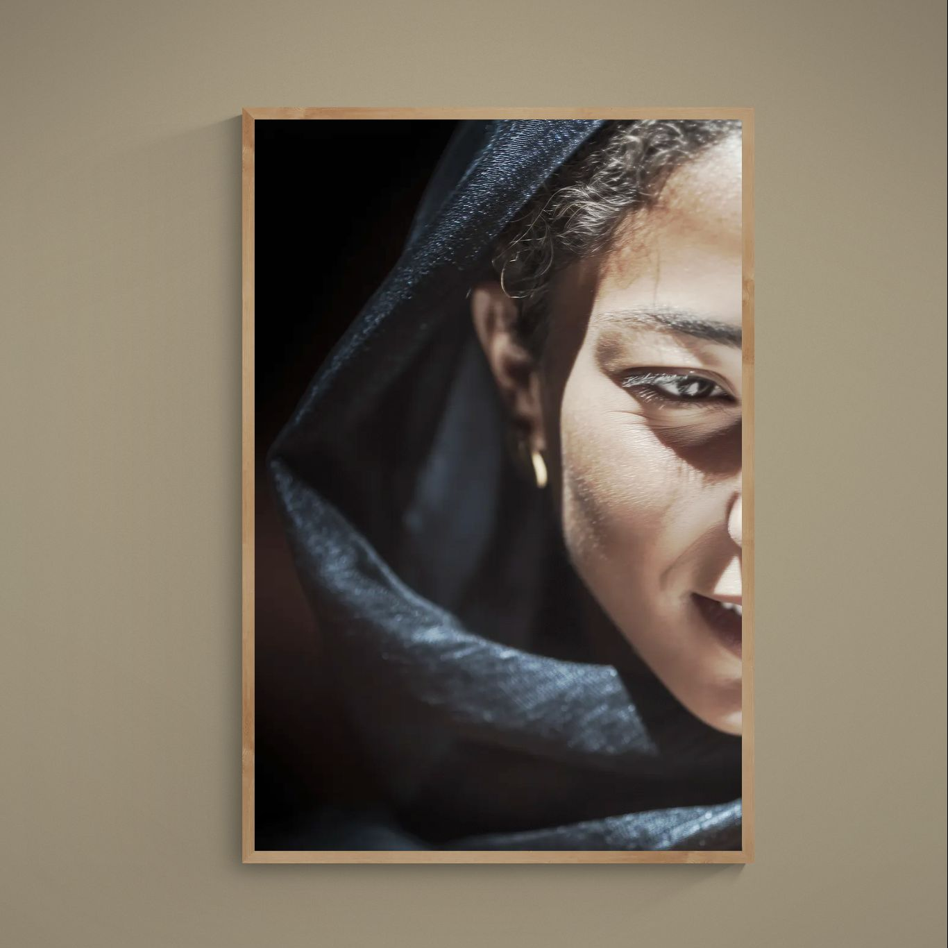 Half-face portrait with black headscarf, warm beige skin, and small gold earring on matte poster