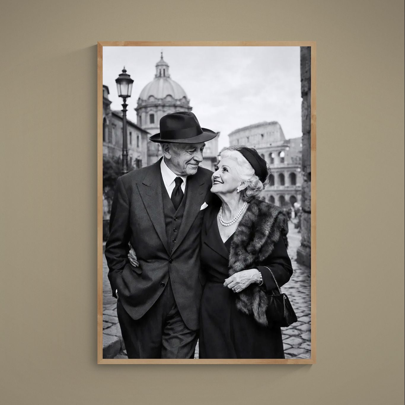 Black and white poster of elderly couple arm-in-arm in Rome with Colosseum behind them