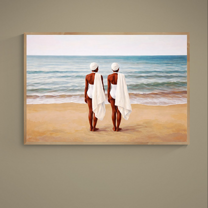 Two women in white swimwear and towels facing a calm ocean horizon on a sandy beach