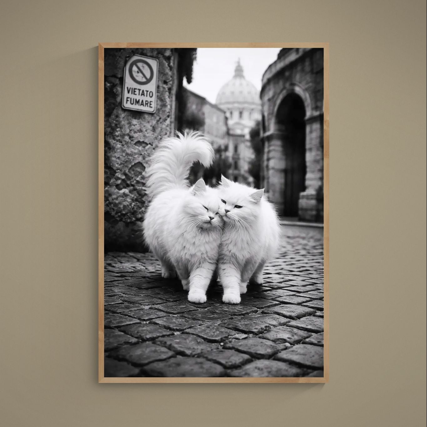 Black and white poster of two white cats nuzzling on a cobblestone street in Rome