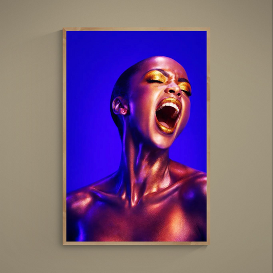 Close-up portrait with gold metallic makeup, bronze body paint and cobalt blue background on matte poster