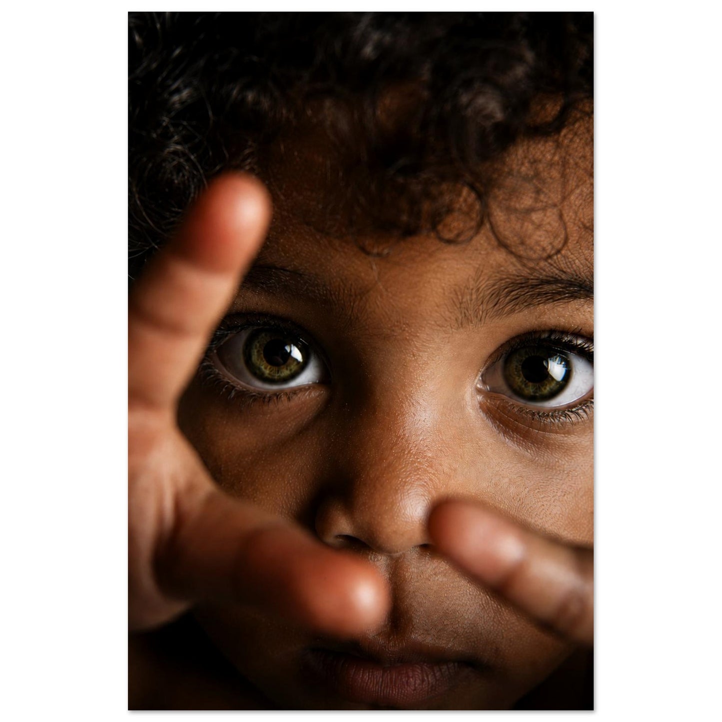 Contemporary art poster featuring a close-up child portrait with expressive eyes on matte paper, brown skin tones, vertical